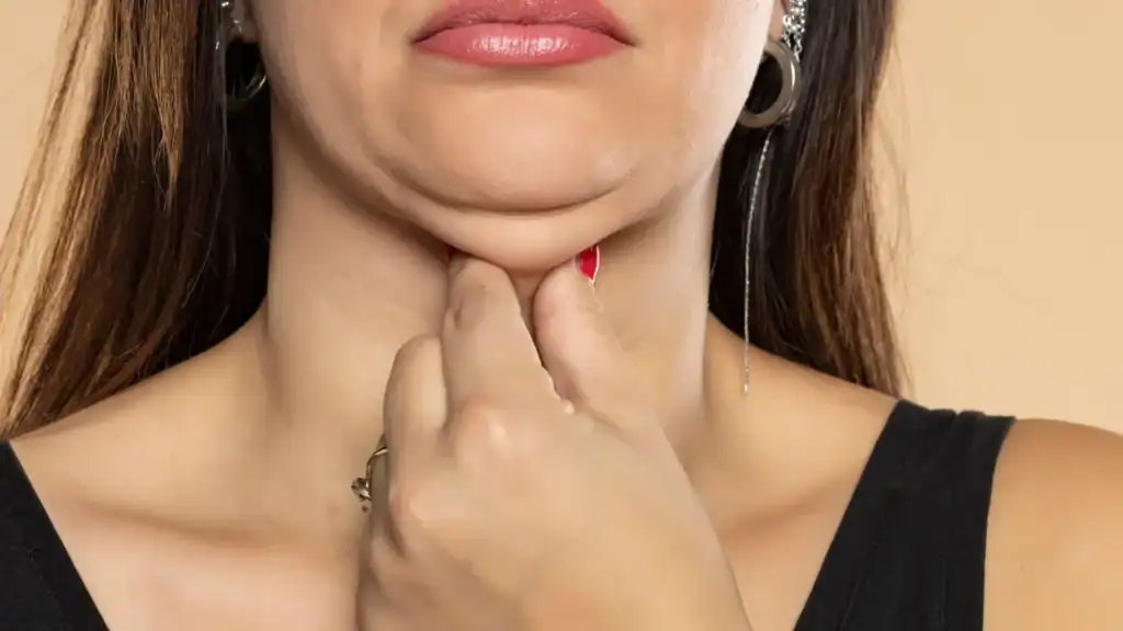 An image of a woman with double chin, sad, worried : Non Surgical Double Chin Removal Treatment in Mickleover, UK