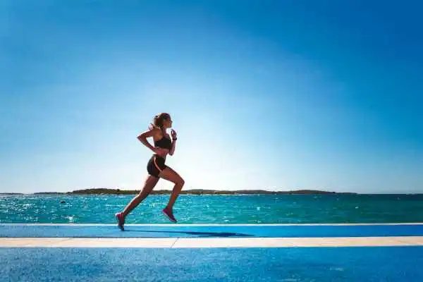 Woman running showing strong leg muscle Mickleover